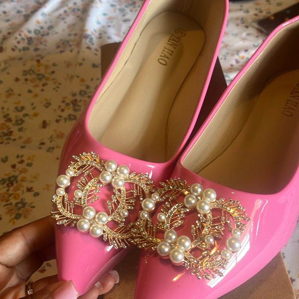 Women’s pink flat shoe with rhinestone detail